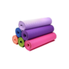 Stack of rolled colorful TPE yoga mats in purple, pink, and green for fitness and floor exercises - IKL Store.